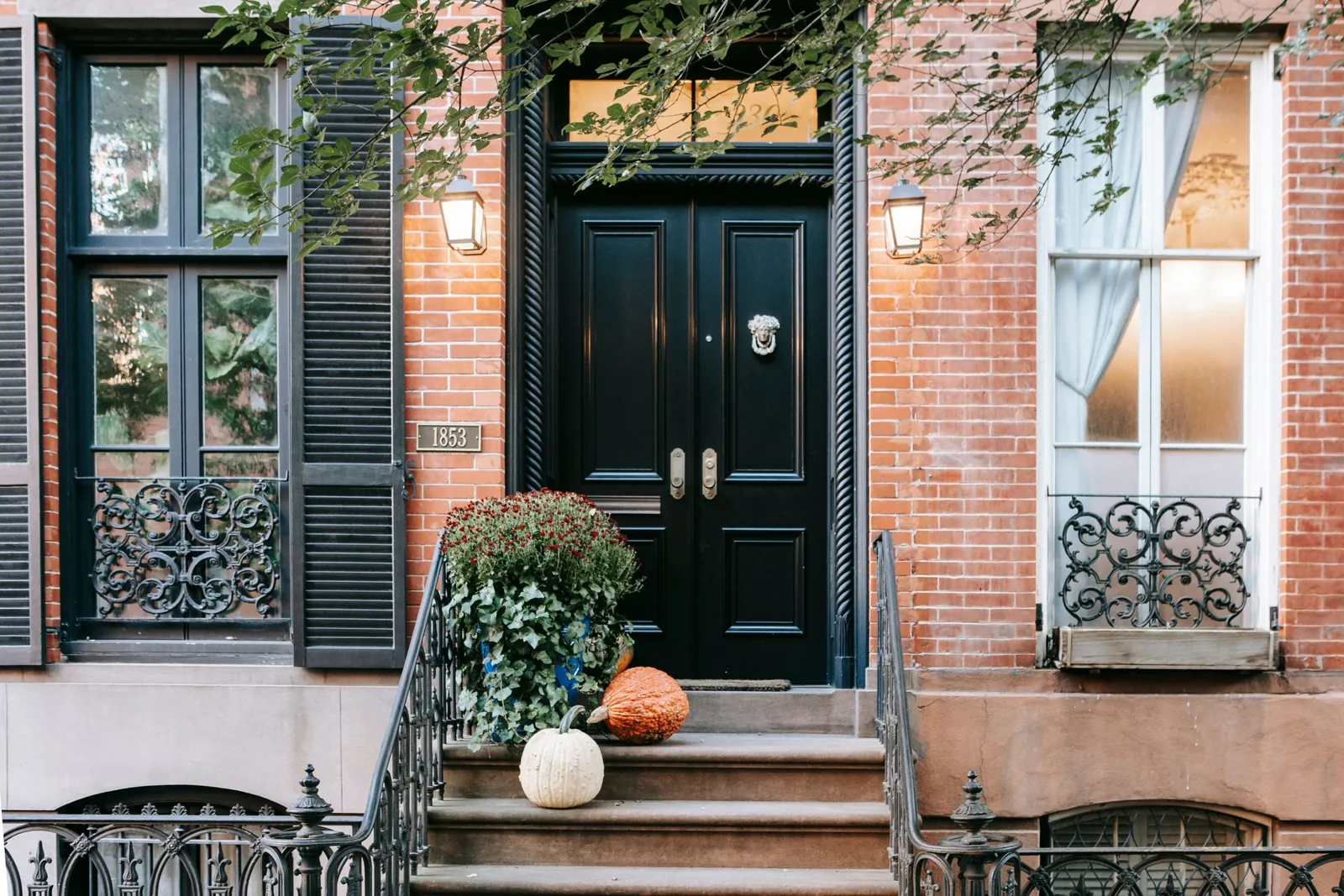 A brownstone stoop and entrance in warm directional light
